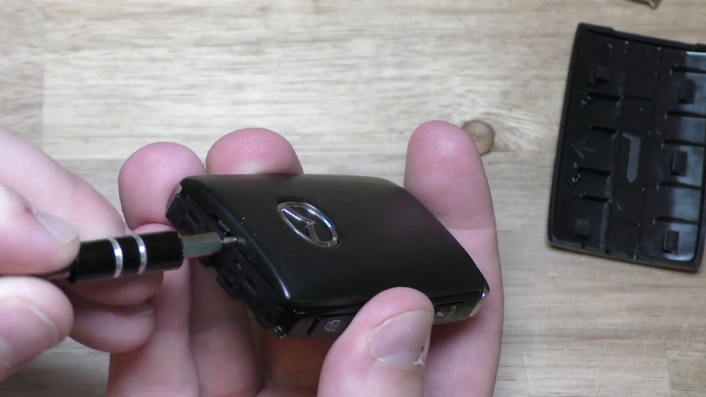 Prying front panel from Mazda 2019 Key Fob